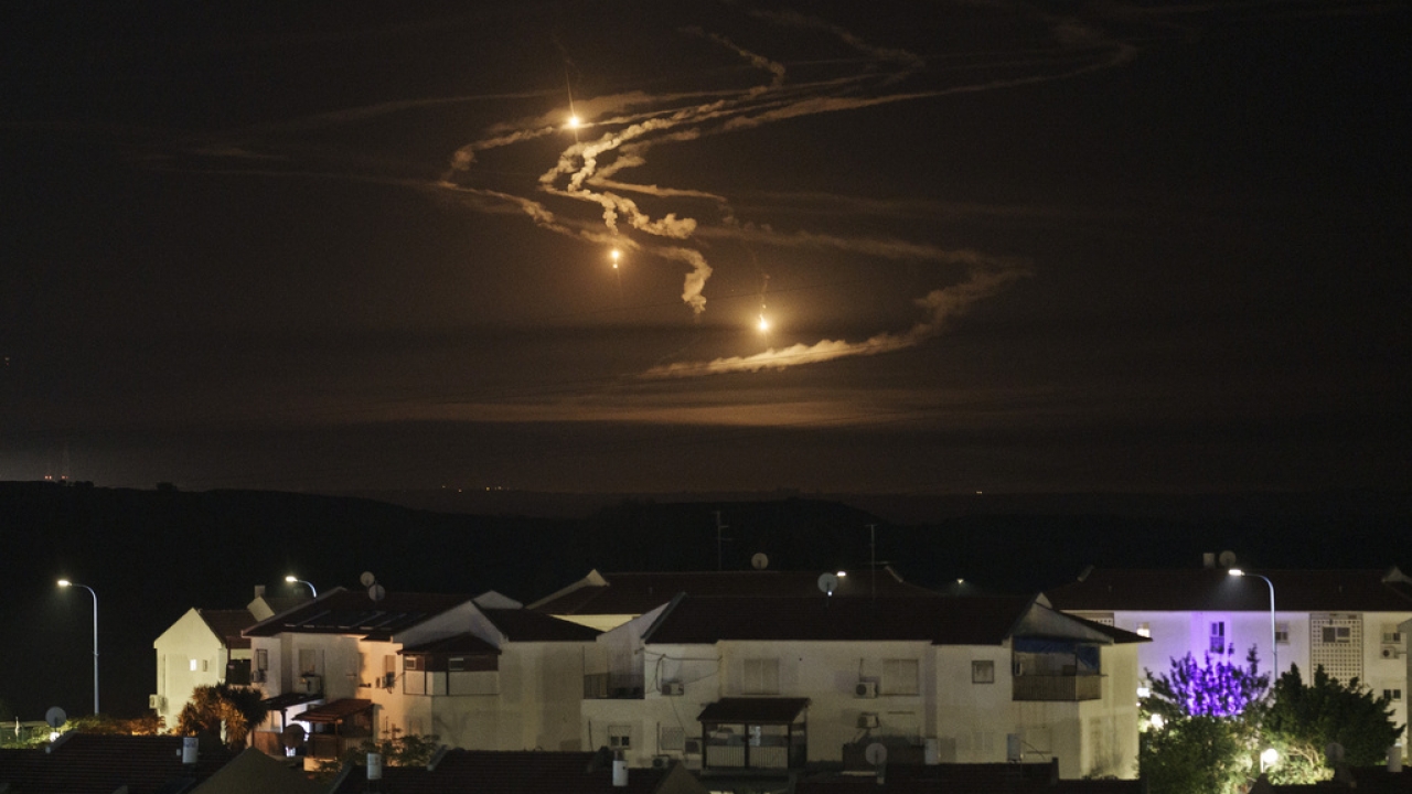Flares rise over the Gaza Strip as seen from southern Israel.