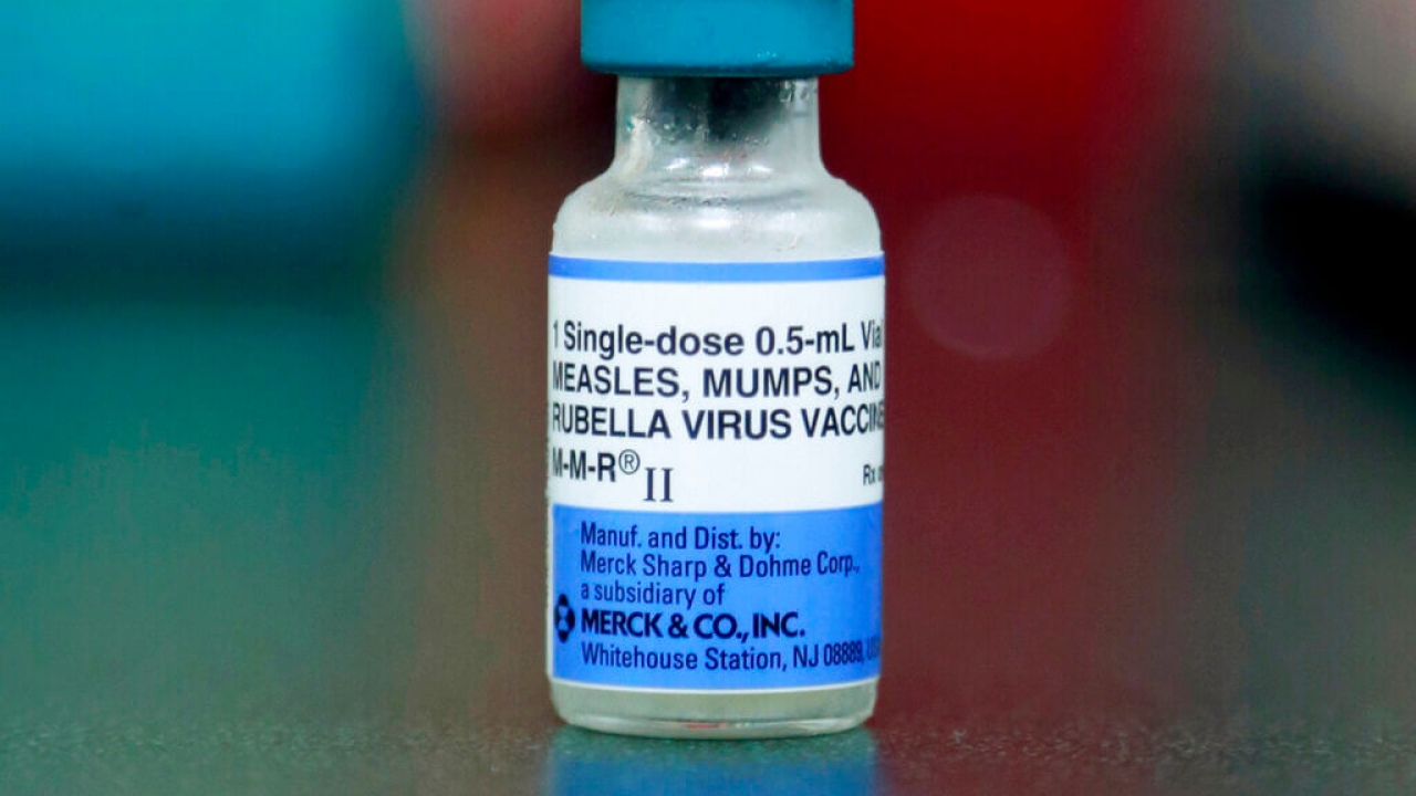 A vial of a measles, mumps and rubella vaccine