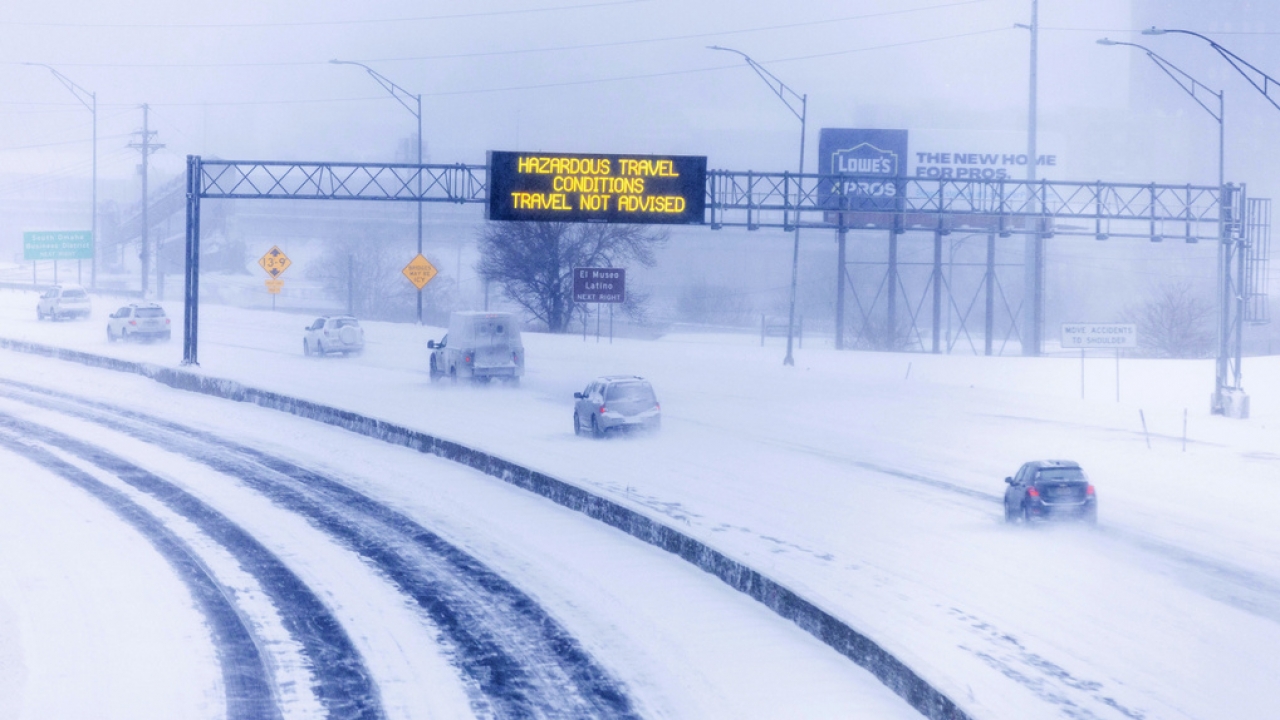 Signs along US Highway 75, looking south from F Street, advise against travel due to snow, Jan. 12, 2024, in Omaha, Neb.