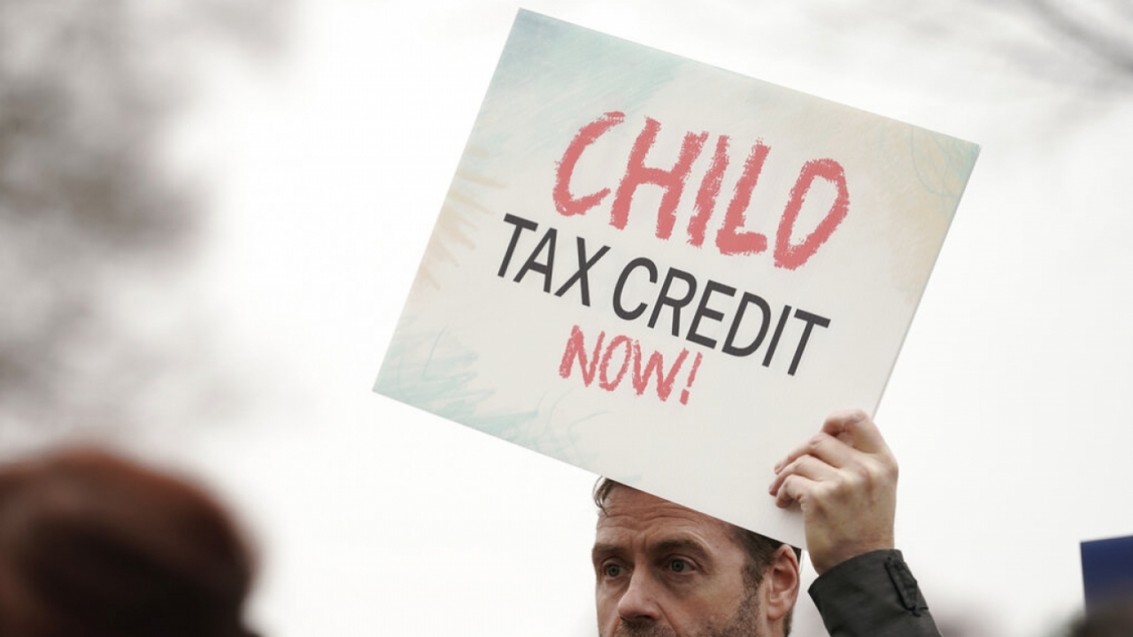 Supporters rally to increase the child tax credit.