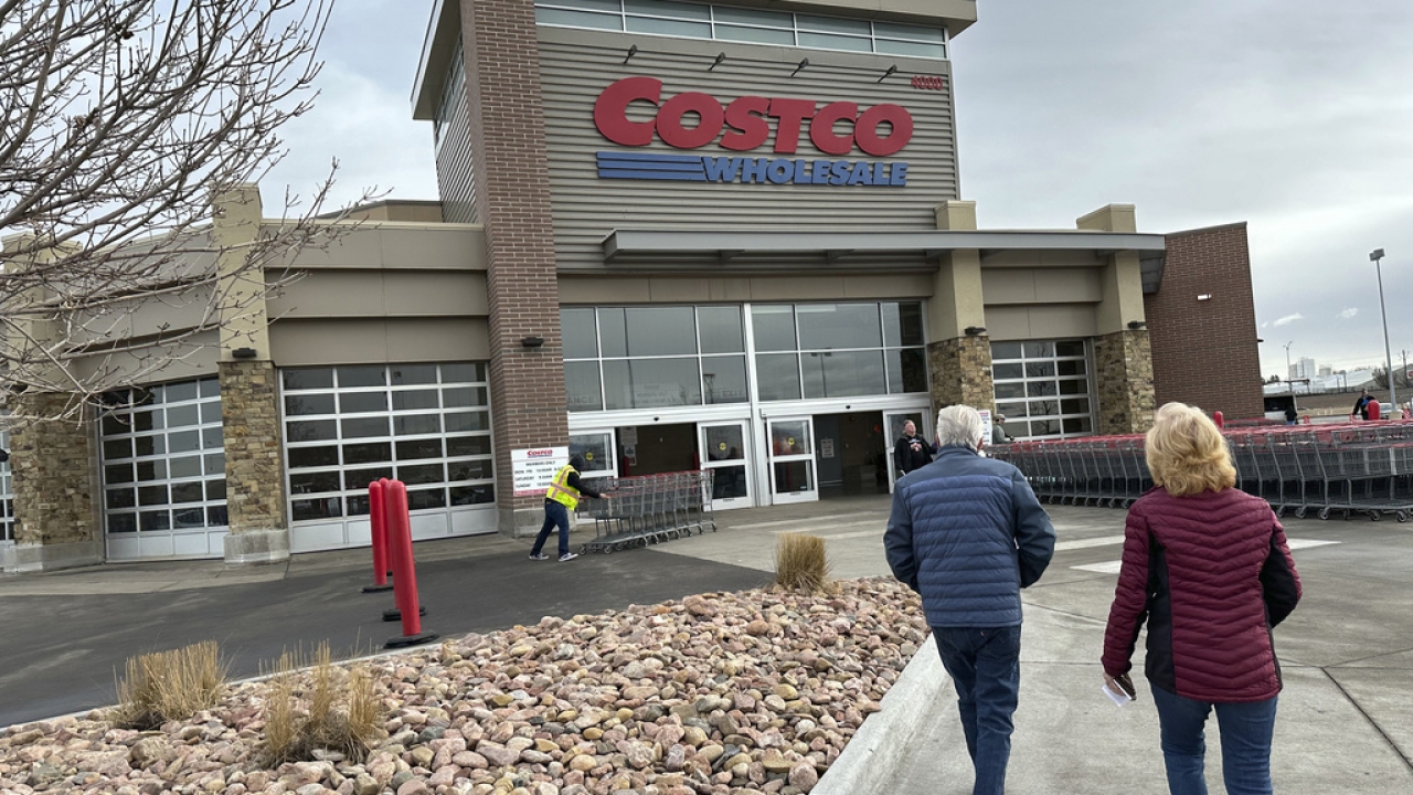Shoppers approach the entrance of a Costco