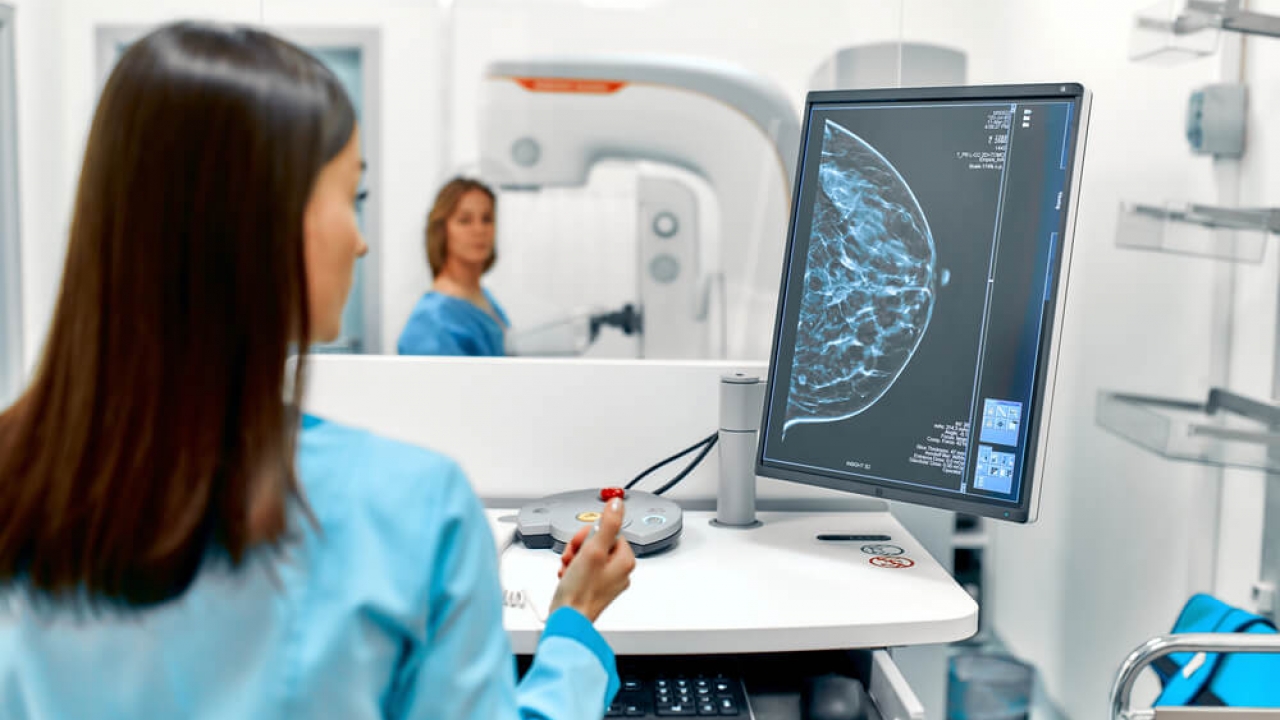 Generic image of a patient undergoes a screening procedure for a mammogram.