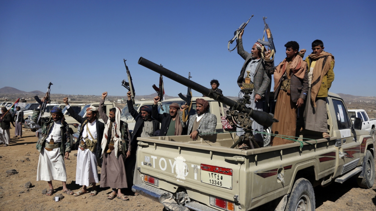 Houthi fighters and tribesmen stage a rally against the U.S. and the U.K. strikes on Houthi-run military sites.