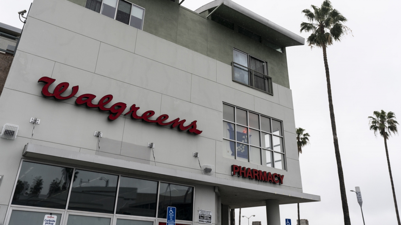 Palm trees stand next to a Walgreens pharmacy in Los Angeles.