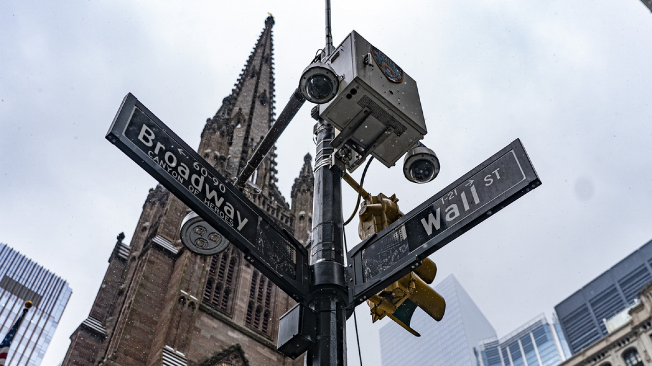 A street sign at the intersection of Wall Street and Broadway.