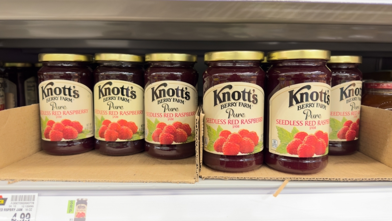 Knott's Berry Farm raspberry jam on grocery shelf.