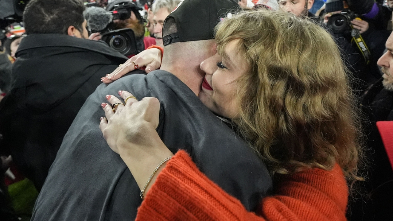 Taylor Swift hugs Travis Kelce after the Kansas City Chiefs' AFC Championship win.