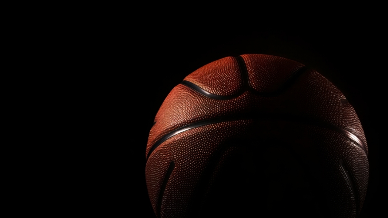 A basketball with a dark background.