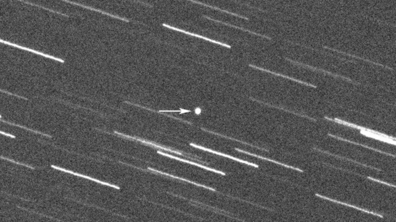 Asteroid 2008 OS7 is pointed out by an arrow