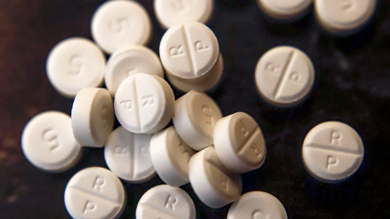 White pills are shown.