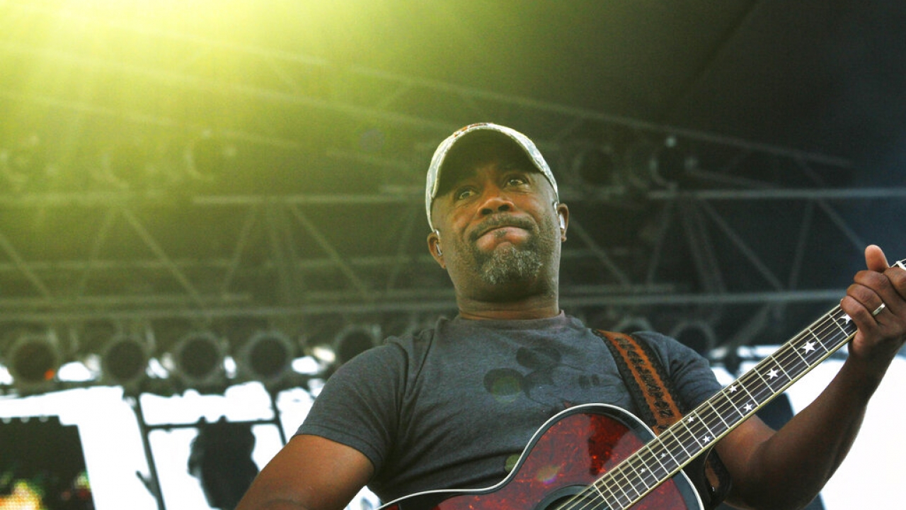 Darius Rucker on stage with a guitar
