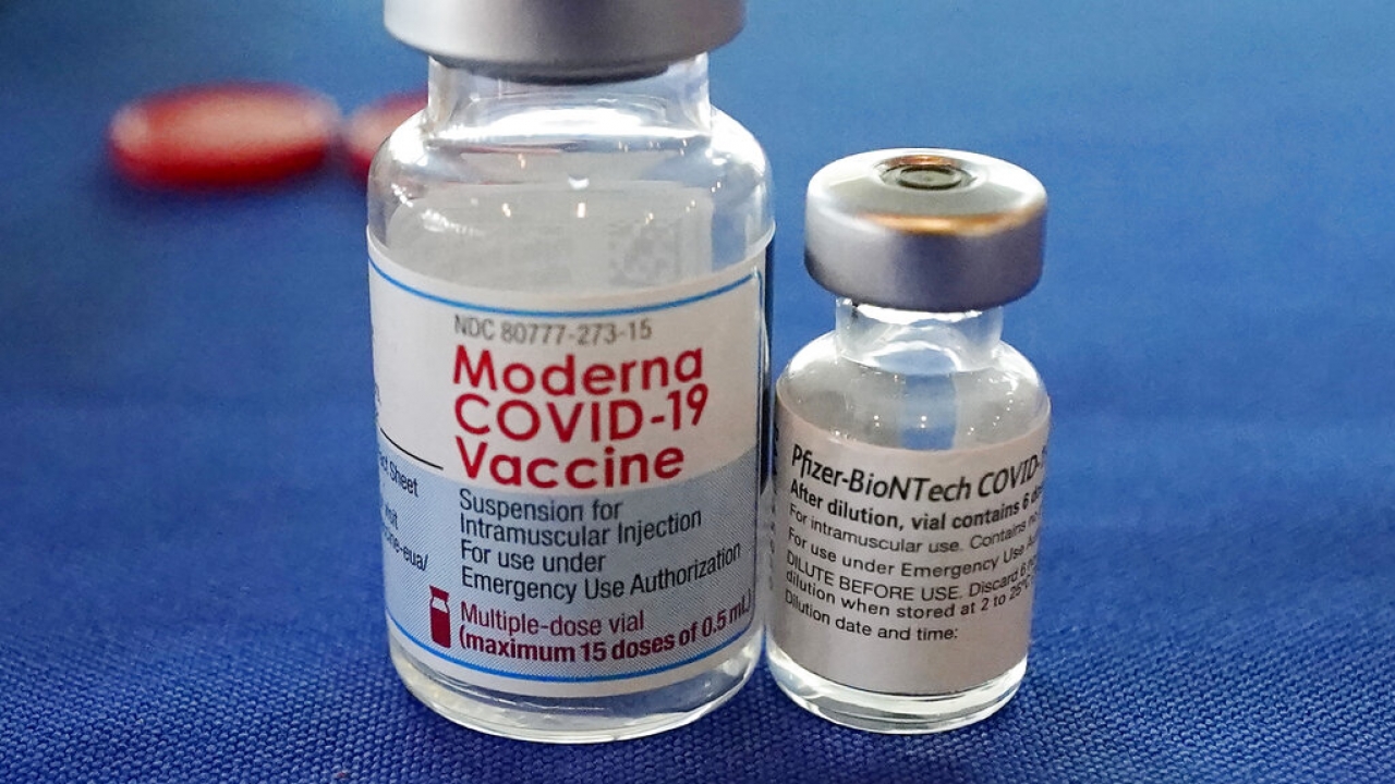 Vials of the Pfizer and Moderna COVID-19 vaccines.