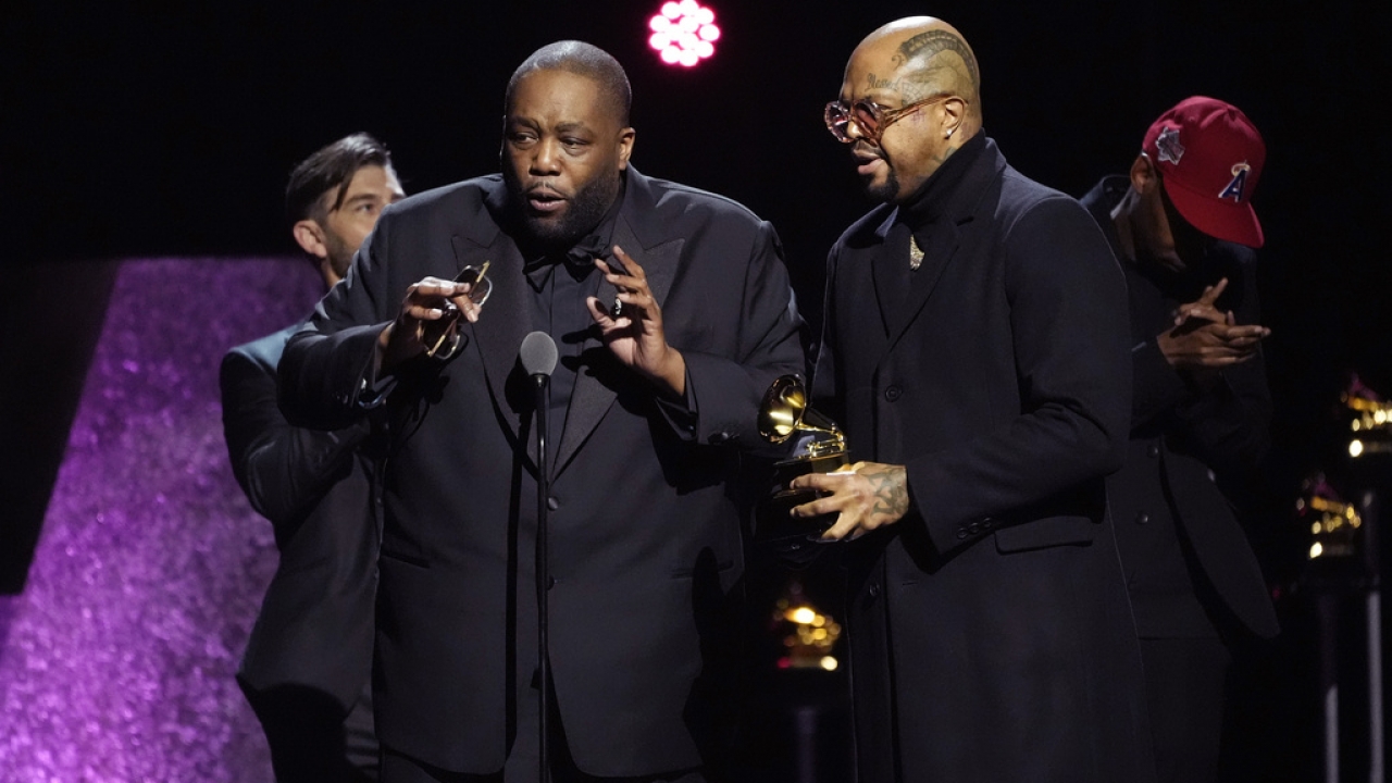 Killer Mike and DJ Paul accepting Grammy award.