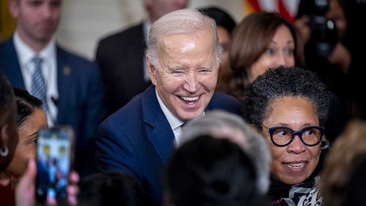 President Joe Biden greet members of the audience during a reception in recognition of Black History Month.