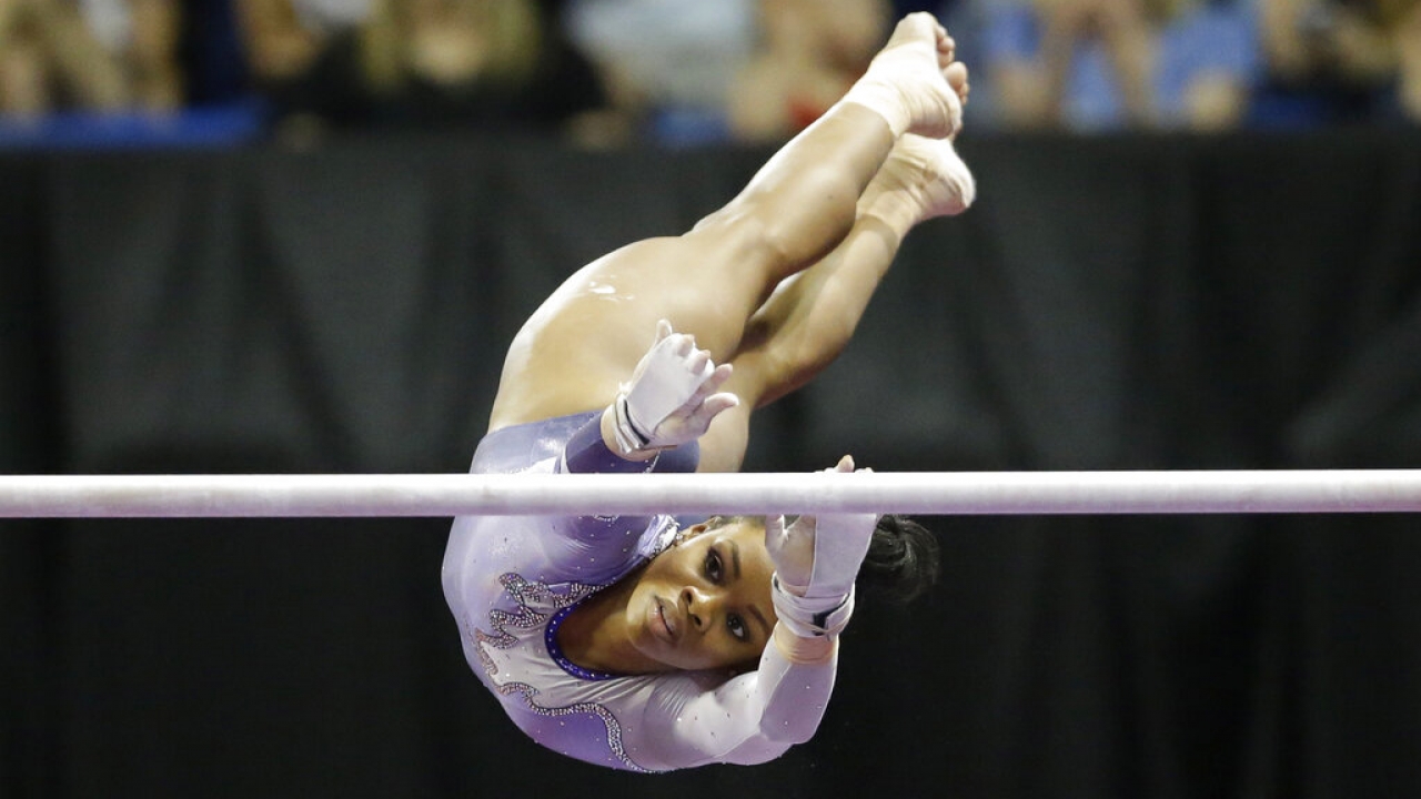 Gabby Douglas competes on the uneven bars during the U.S. women's gymnastics championships.
