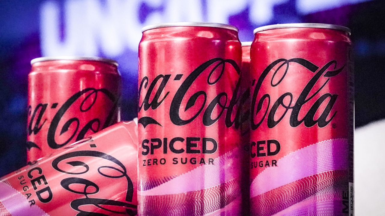Cans of Coca-Cola Spiced are shown.