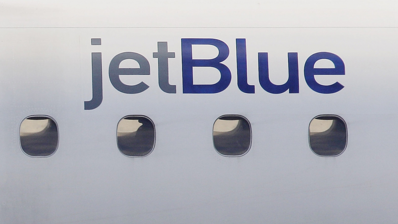 A JetBlue logo is displayed on the side of a jet.
