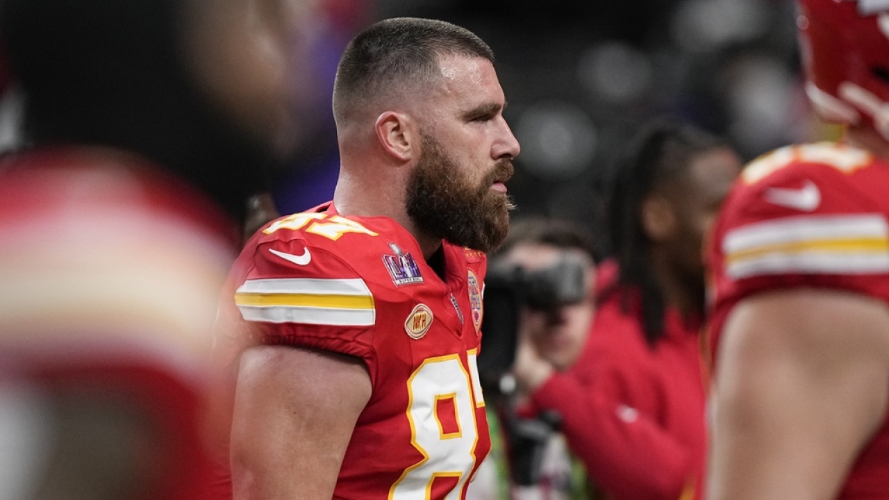 Kansas City Chiefs tight end Travis Kelce stands on the sidelines.