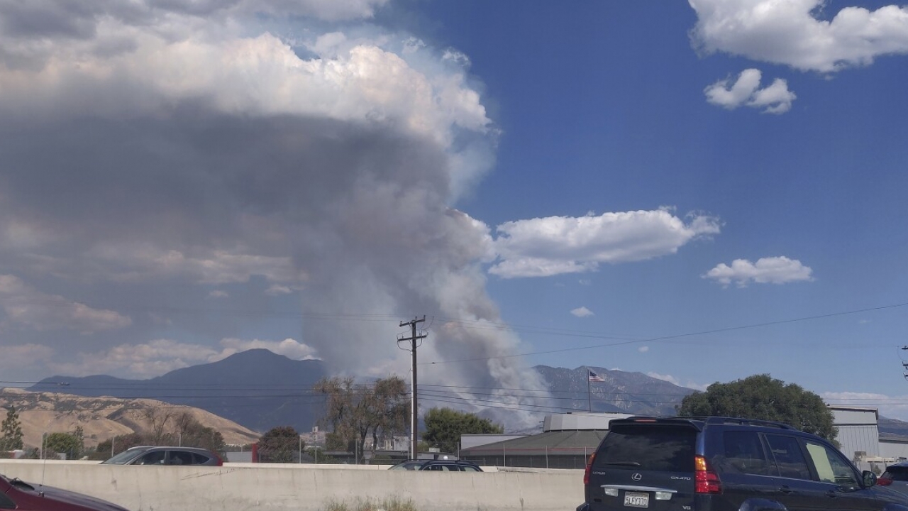 A plume of smoke from the El Dorado Fire is seen from Interstate 10 in Loma Linda, California, Saturday, Sept. 5, 2020.