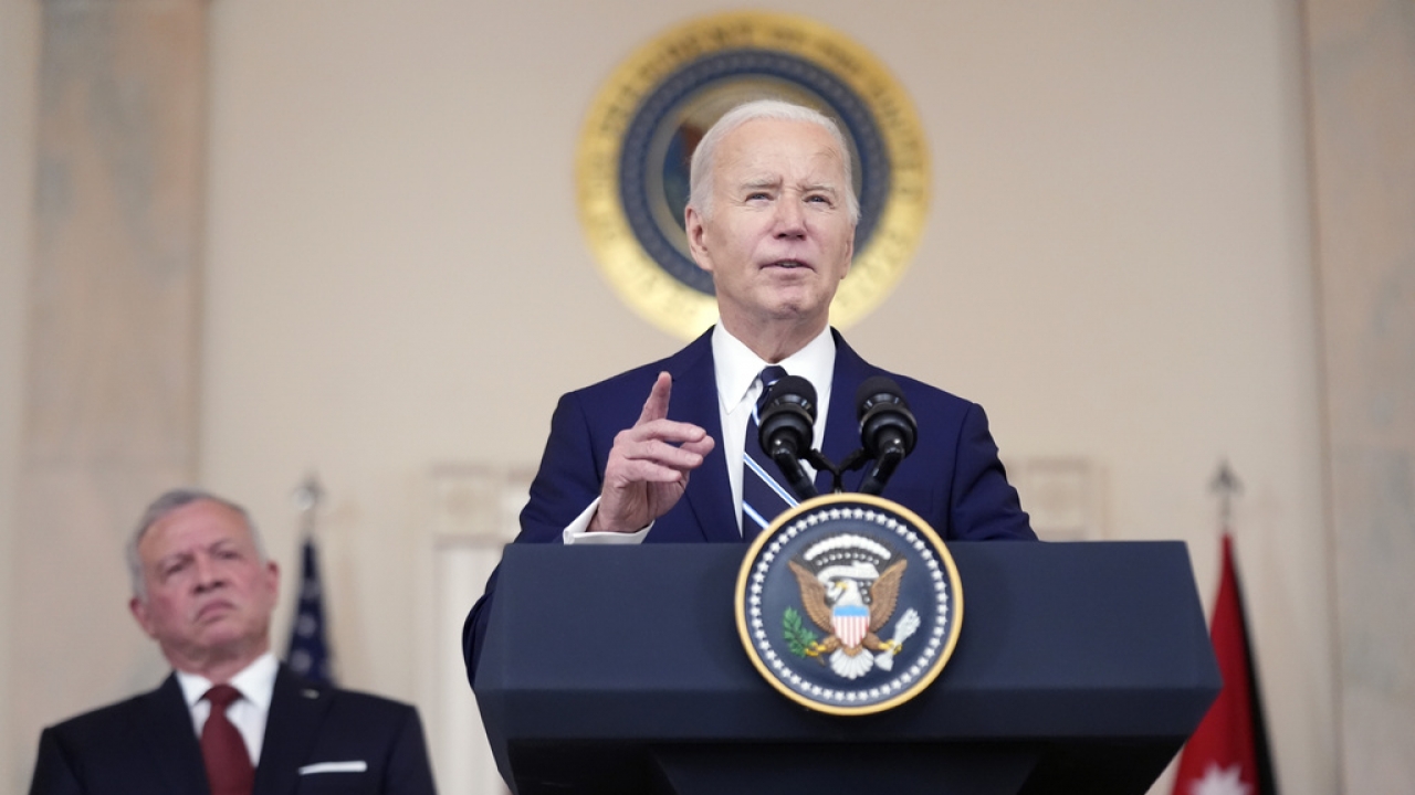 President Biden speaks at a podium.