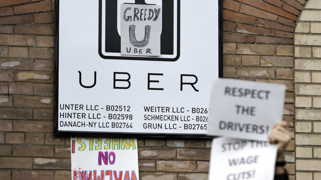 Uber drivers rally for higher wages.
